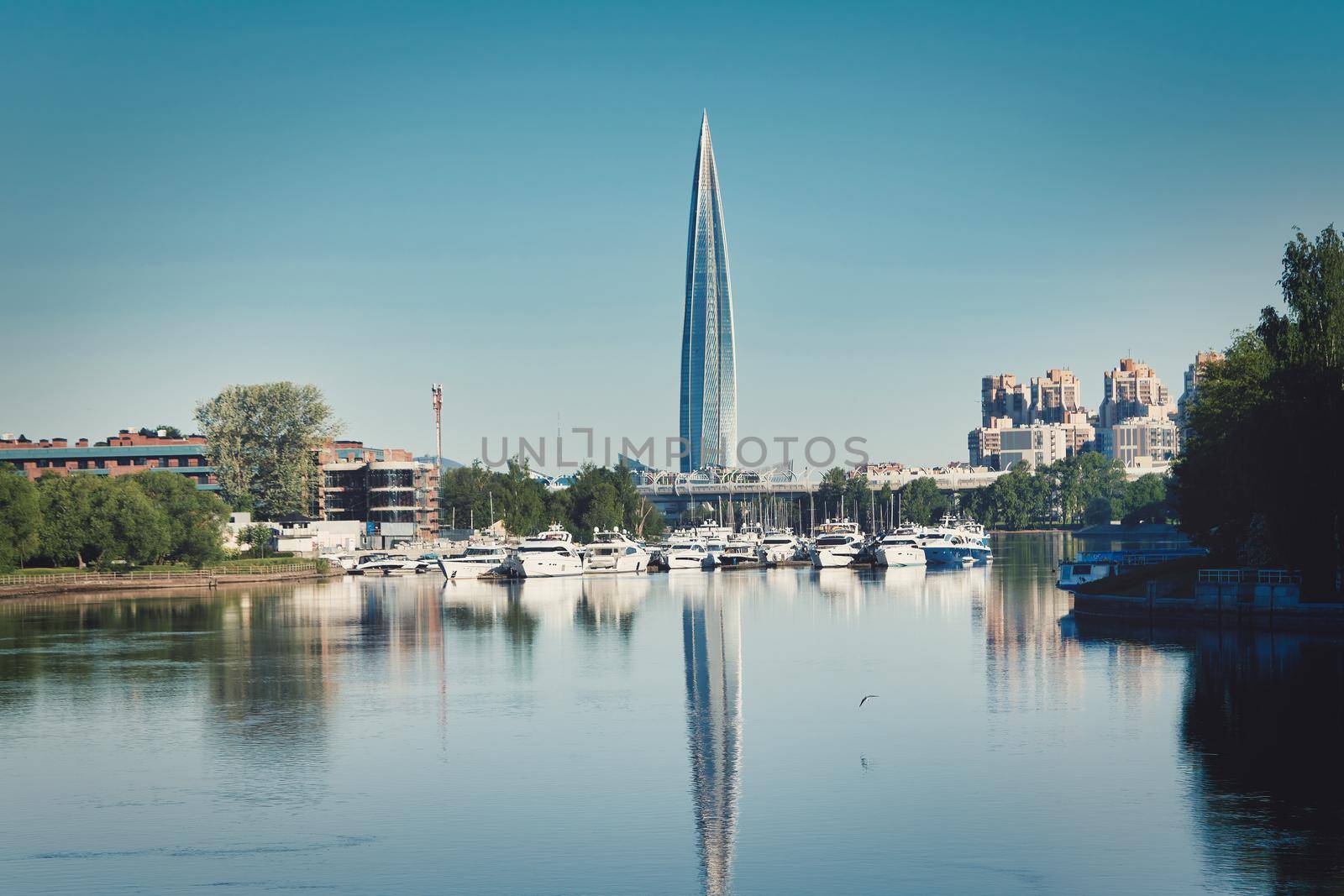 Skyscraper of Gazprom in St. Petersburg with fucking in river against background of a blue sky, cityscape on summer sunny day