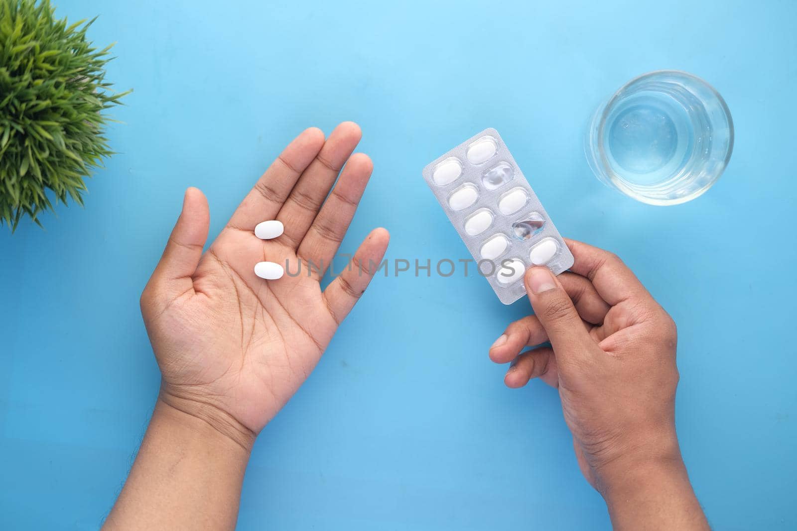 Close up of man holding blister packs