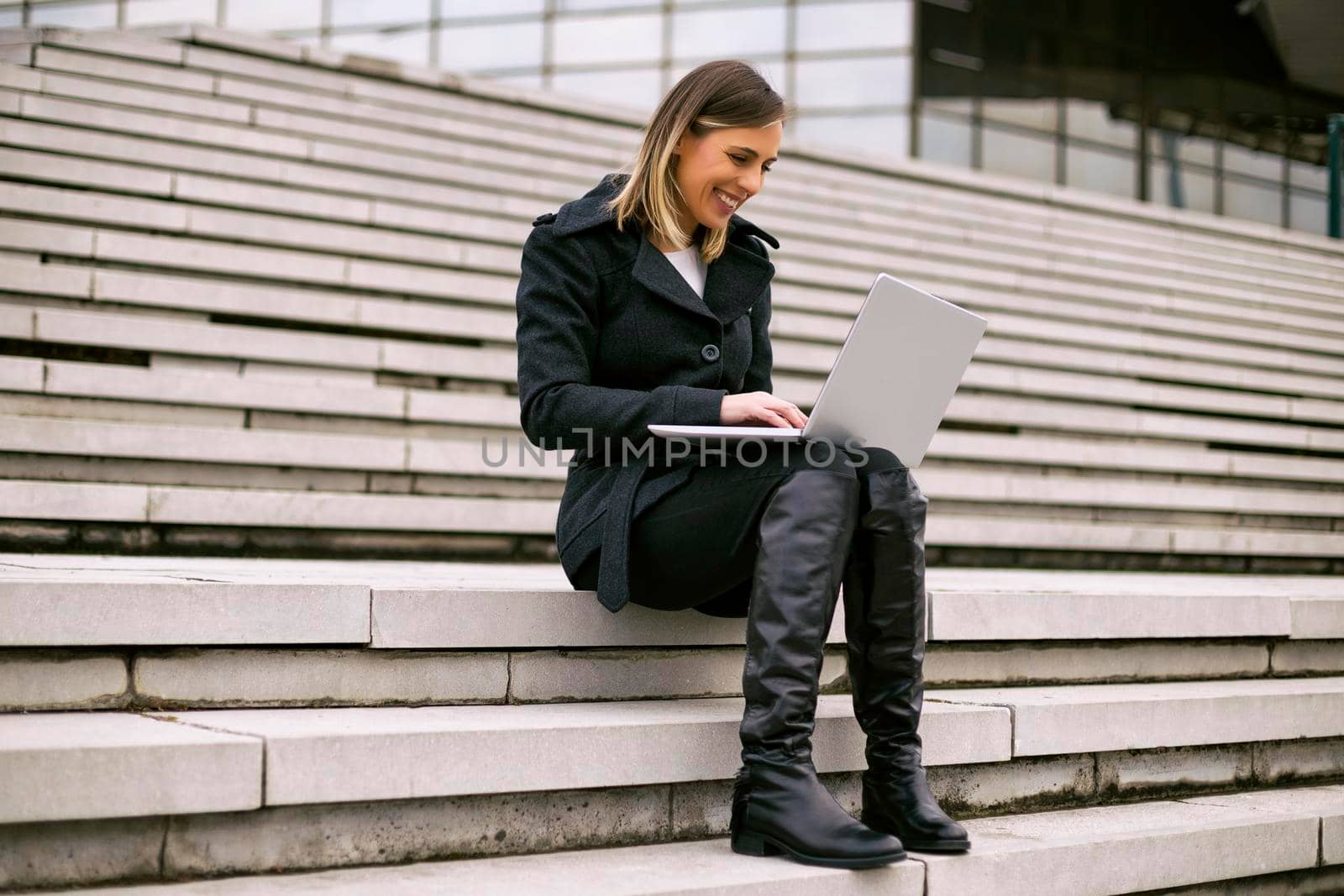 Businesswoman using laptop. by Bazdar