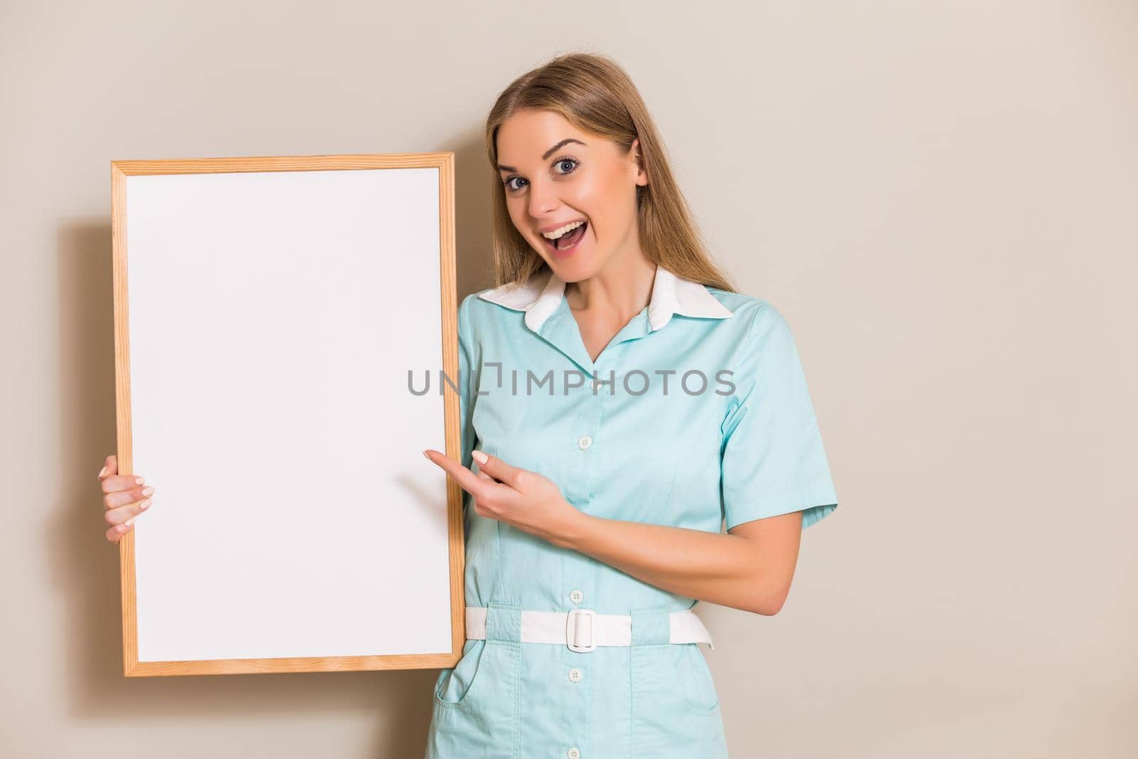 Medical nurse pointing at white board by Bazdar
