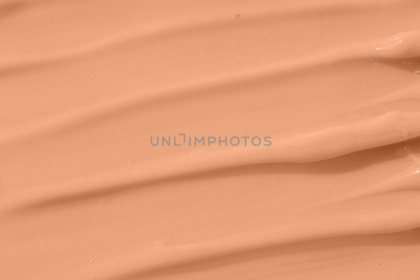 Cosmetic tonal moisturizer, bb cream swatch sample. Beige nude liquid foundation texture, concealer smear smudge drop. Make up base, cream textured background. by photolime