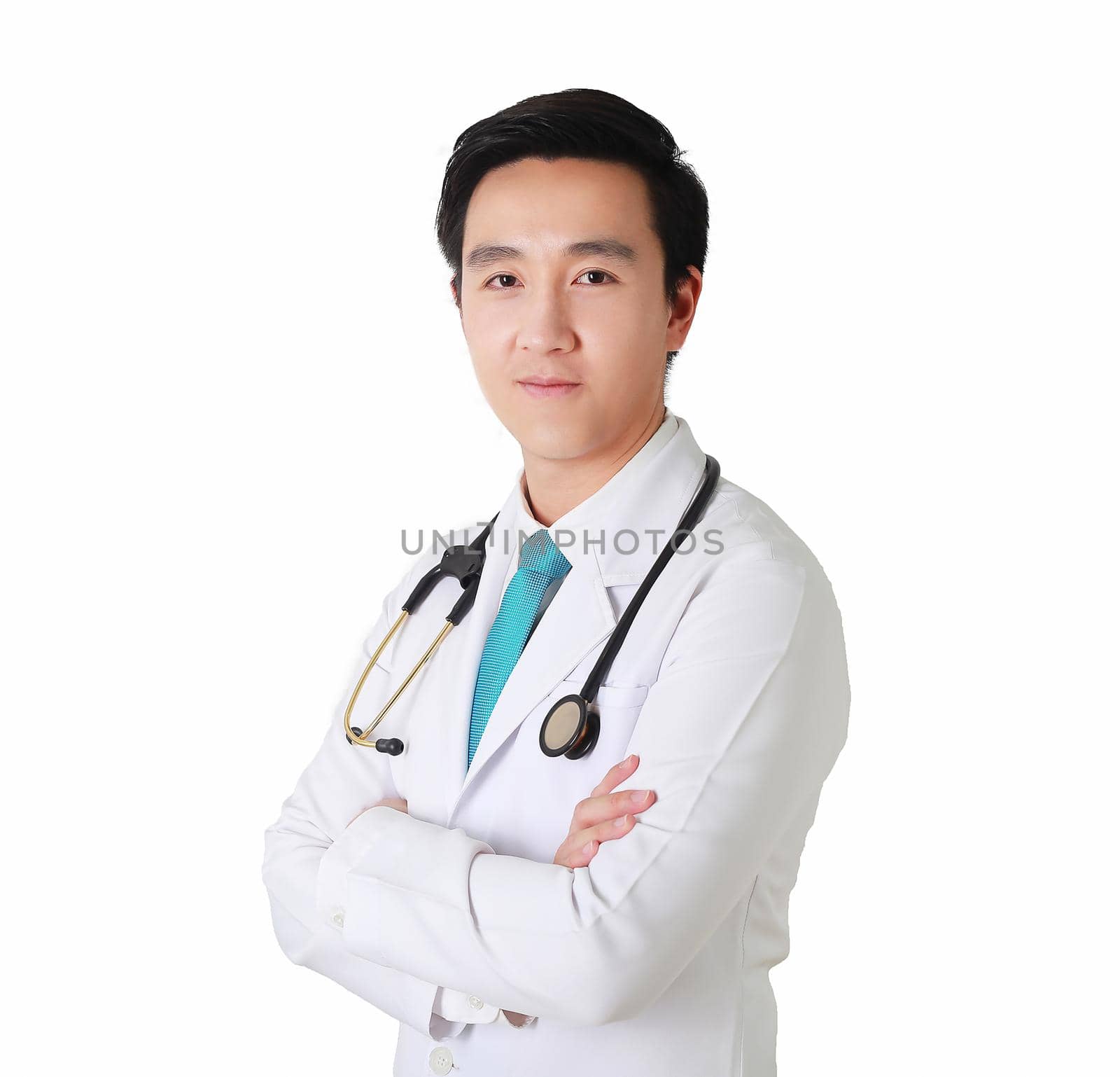Smart doctor posing with arms crossed, medical staff working on the background. by jayzynism