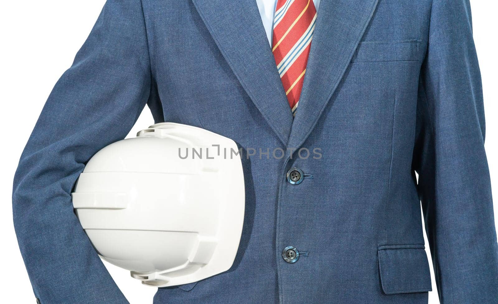 Cloes up man standing in blue suit holding white hardhat isolated on white background