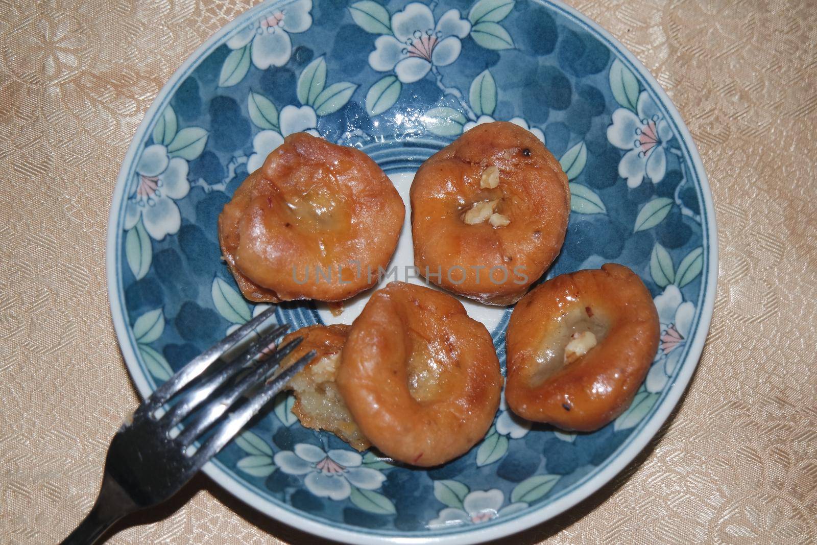 Closeup of delicious and tasty Asian sweet dish called balu shahi or baloshahi or balushahi. This dish is street sweet found in Pakistan India and Bangladesh and served in the festivities.