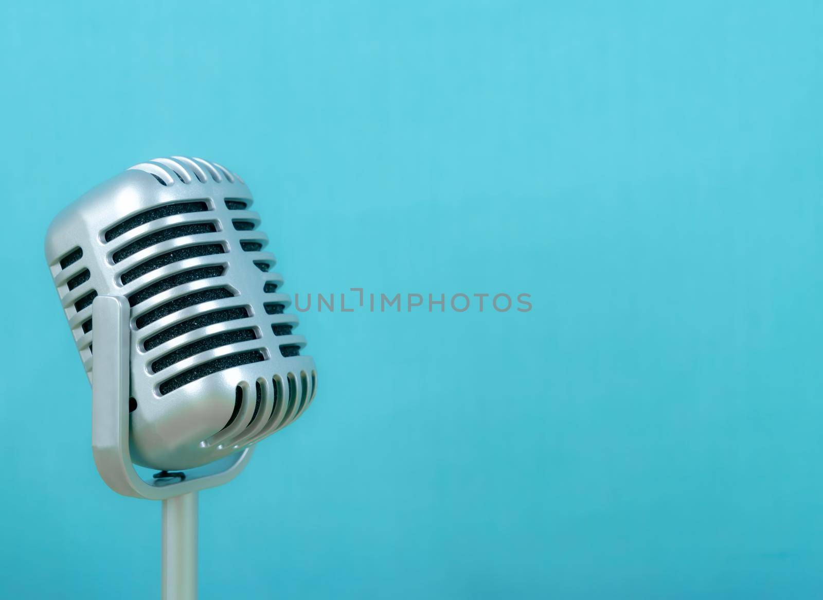 Retro microphone on blue background by Buttus_casso