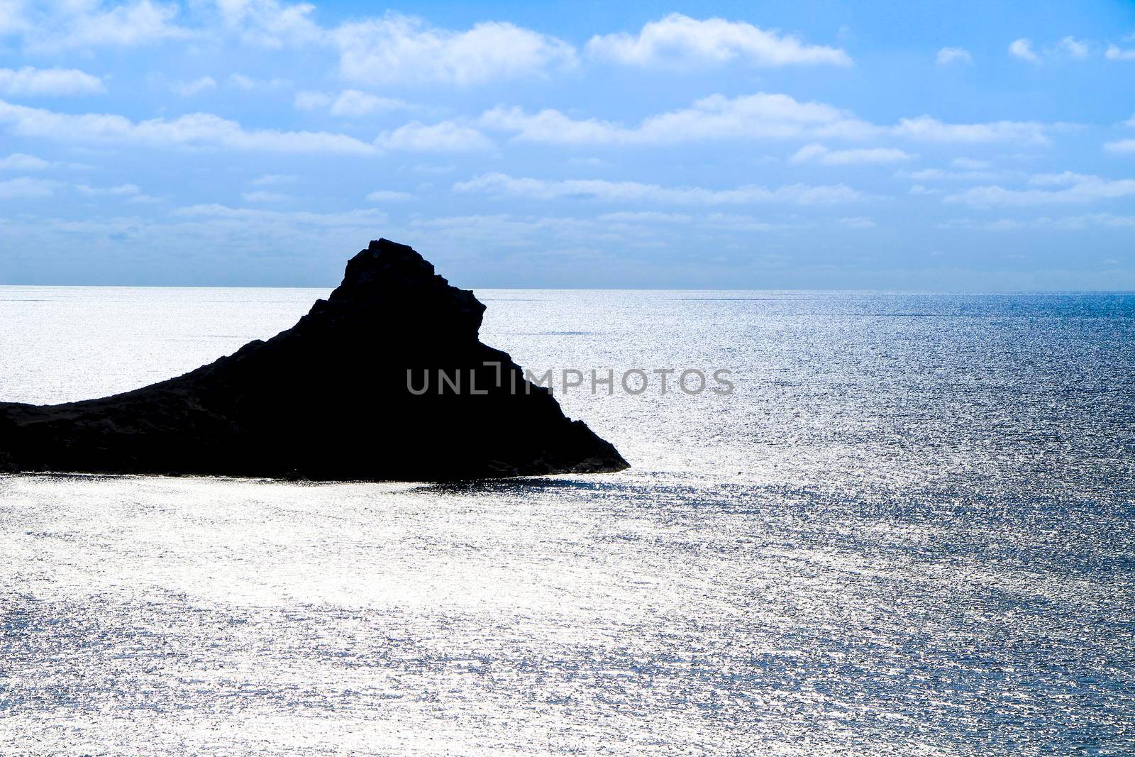 Silhouette of little islet of Siren Reef in Cabo de Gata-Nijar Natural Park, Almeria, Spain.