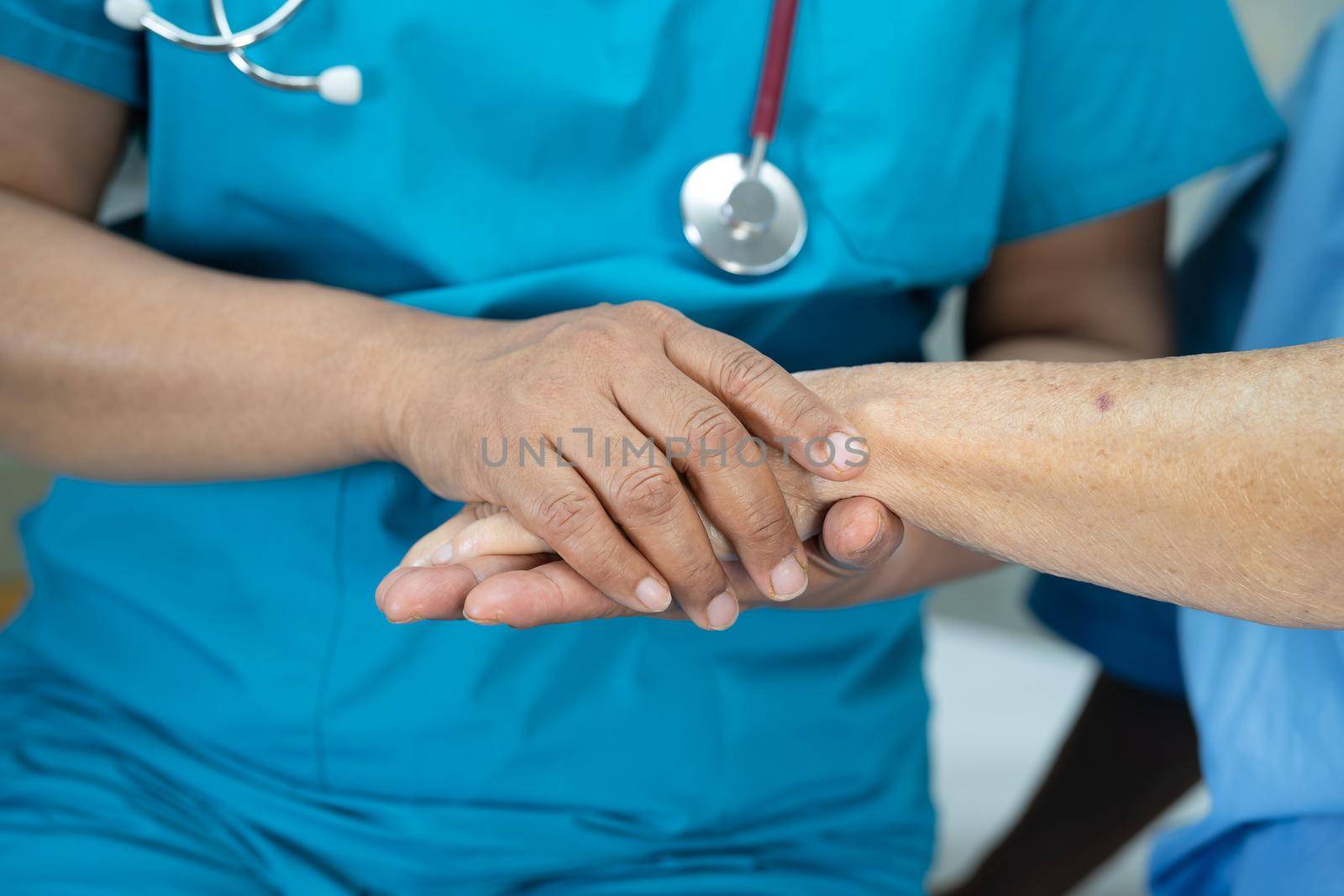 Holding hands Asian senior or elderly old lady woman patient with love, care, encourage and empathy at nursing hospital ward, healthy strong medical concept