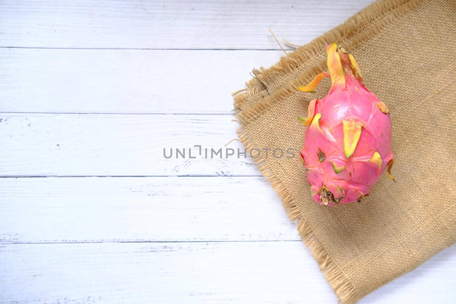 slice of dragon fruit on a table with copy space .