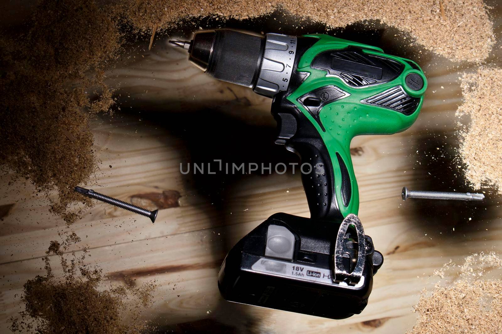 Conceptual photo of green power drill by jyurinko