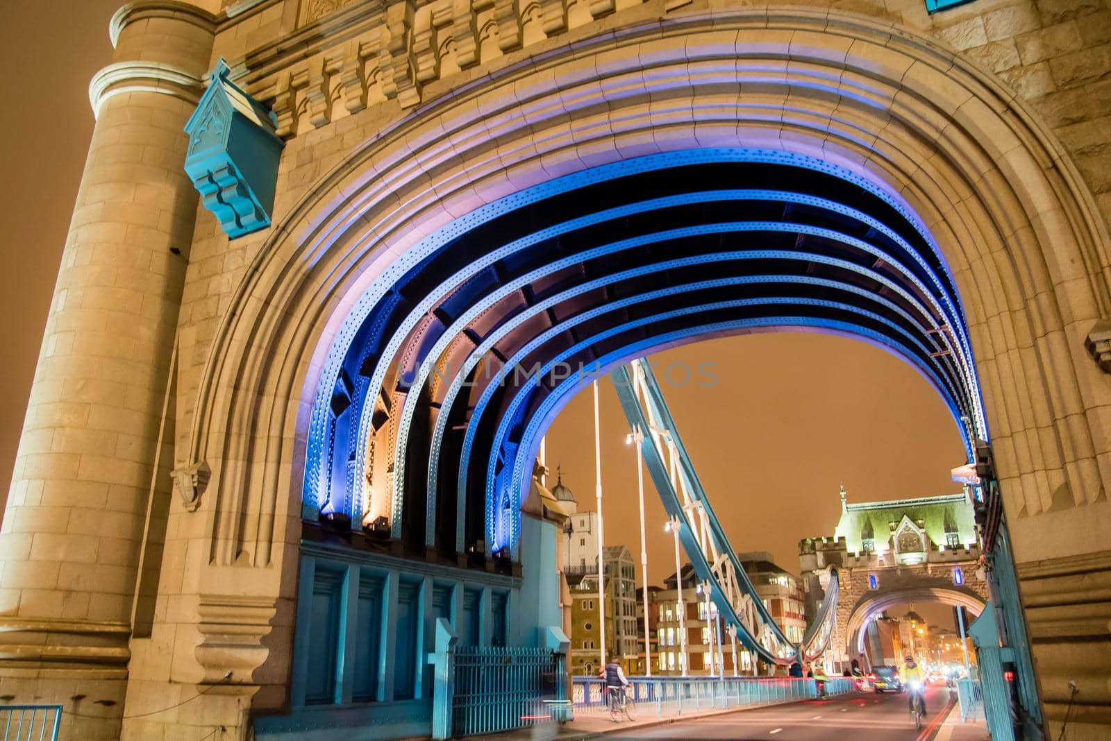 Under the arch of Tower Bridge in London, England. by jyurinko