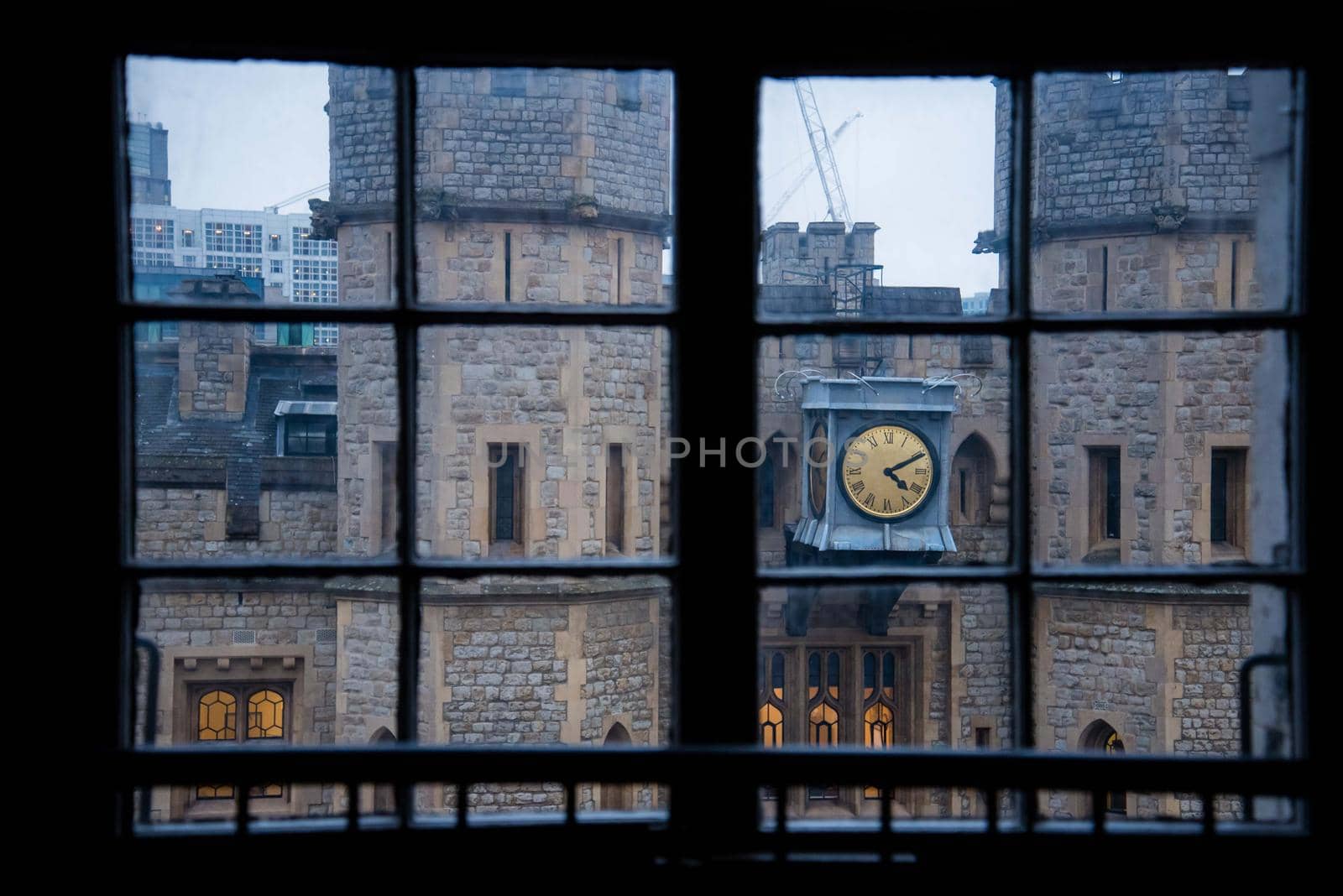 Tower of London castle clock tower framed within a window view abstract geometric unique angle by jyurinko