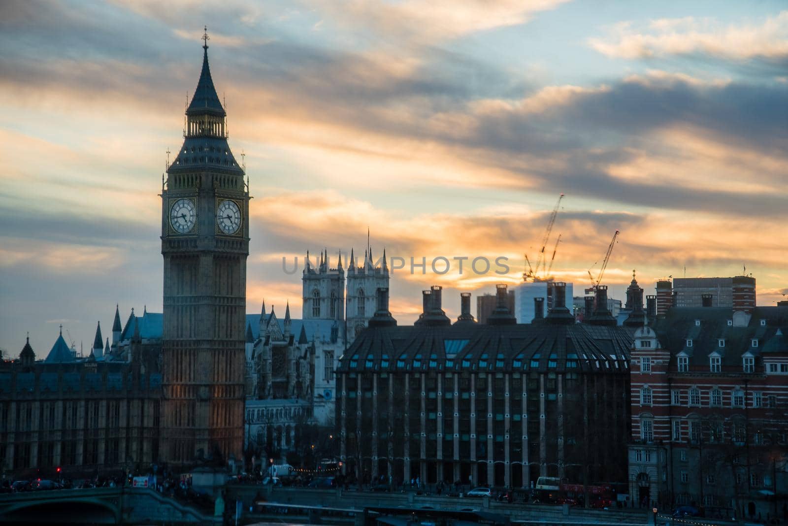 Big Ben Clock tower of London Parliament with a heavenly blue and yellow sunset. by jyurinko