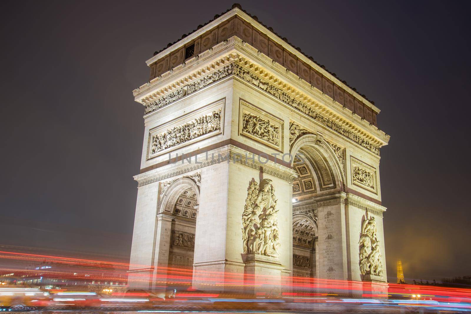 Paris, France - February 3, 2017: Paris Arc de Triomphe long exposure with traffic lights. Majestic Structure