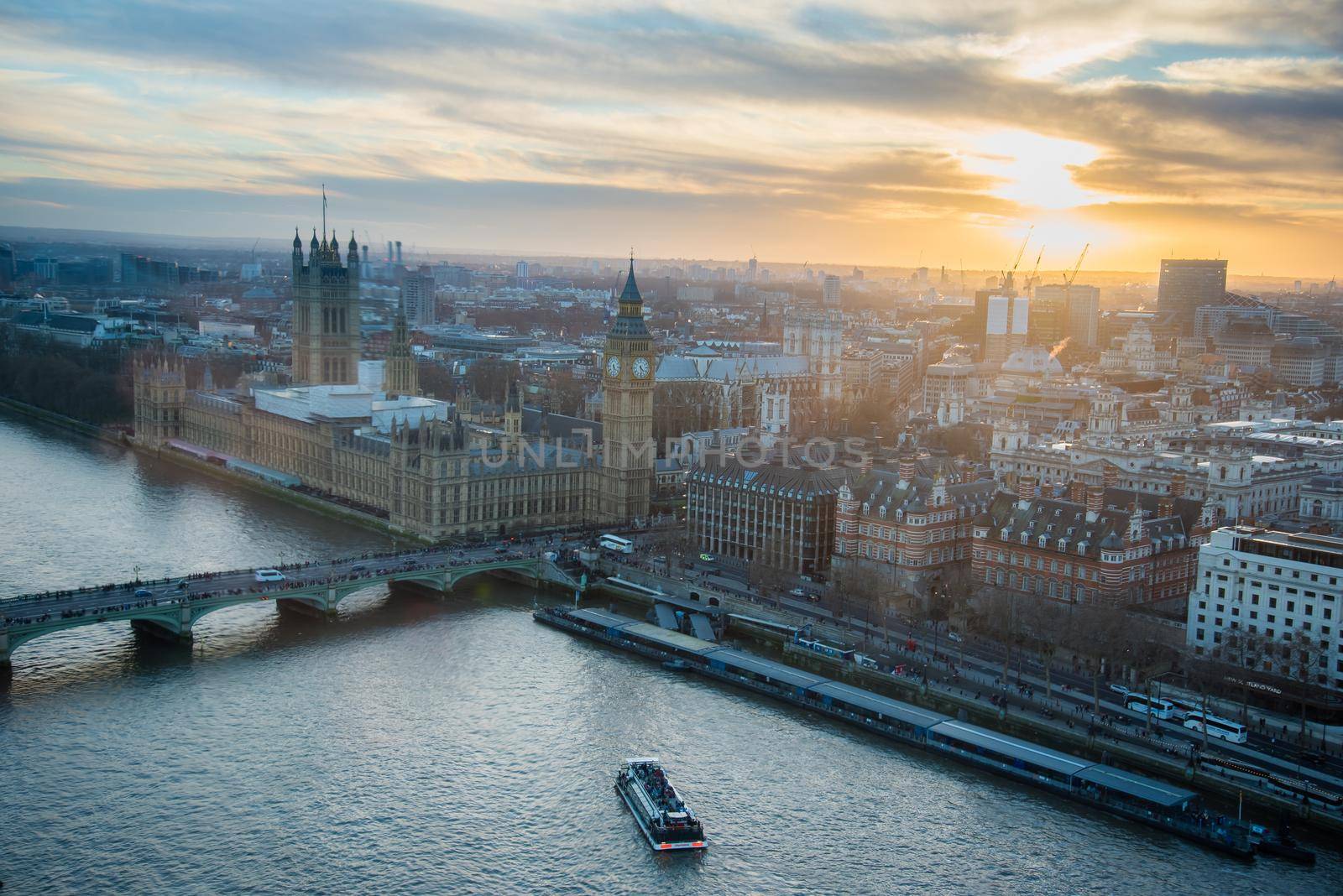 London, UK - February 4, 2017: The Parliament boasting in the skyline during a gorgeous sunset from an aerial view of downtown London.