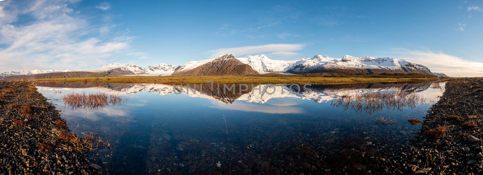 Panorama of Icelandic mountain range with beautiful snowcapped mountains by jyurinko