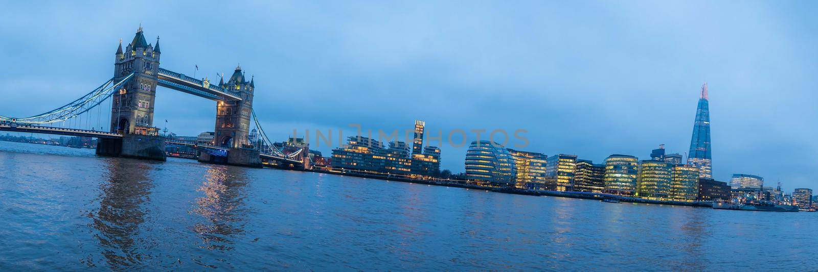 London, UK - January 26, 2017: Panorama of the iconic Tower Bridge connecting Londong with Southwark on the Thames River with the London city skyline in the background with view of the Shard