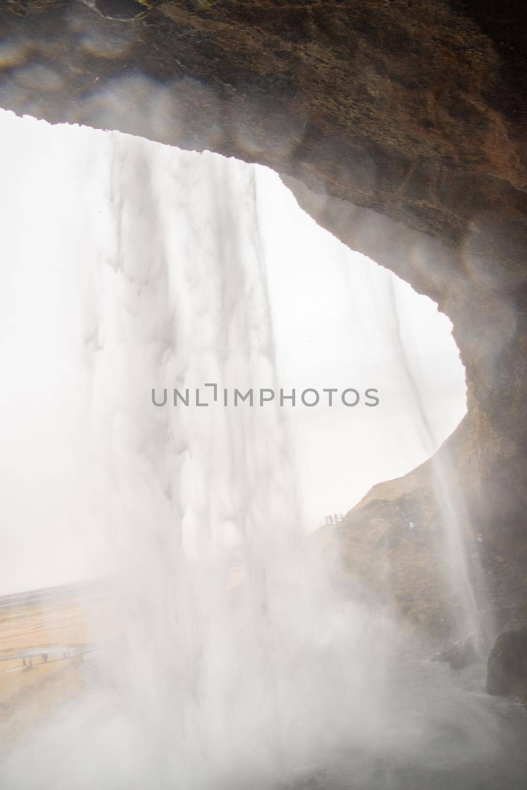 Skogafoss waterfall from the top in Iceland misty spraying by jyurinko