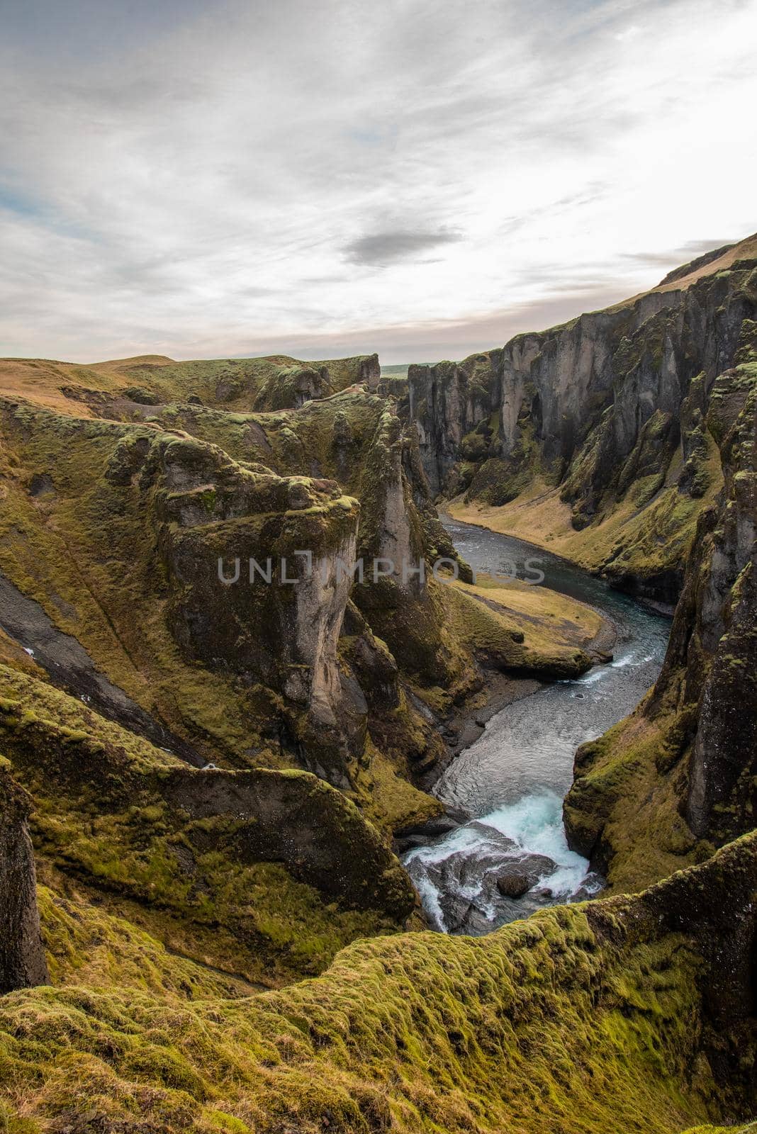 Fjaorargljufur, Iceland mossy green canyon with breathtaking views. Vertical crop. by jyurinko
