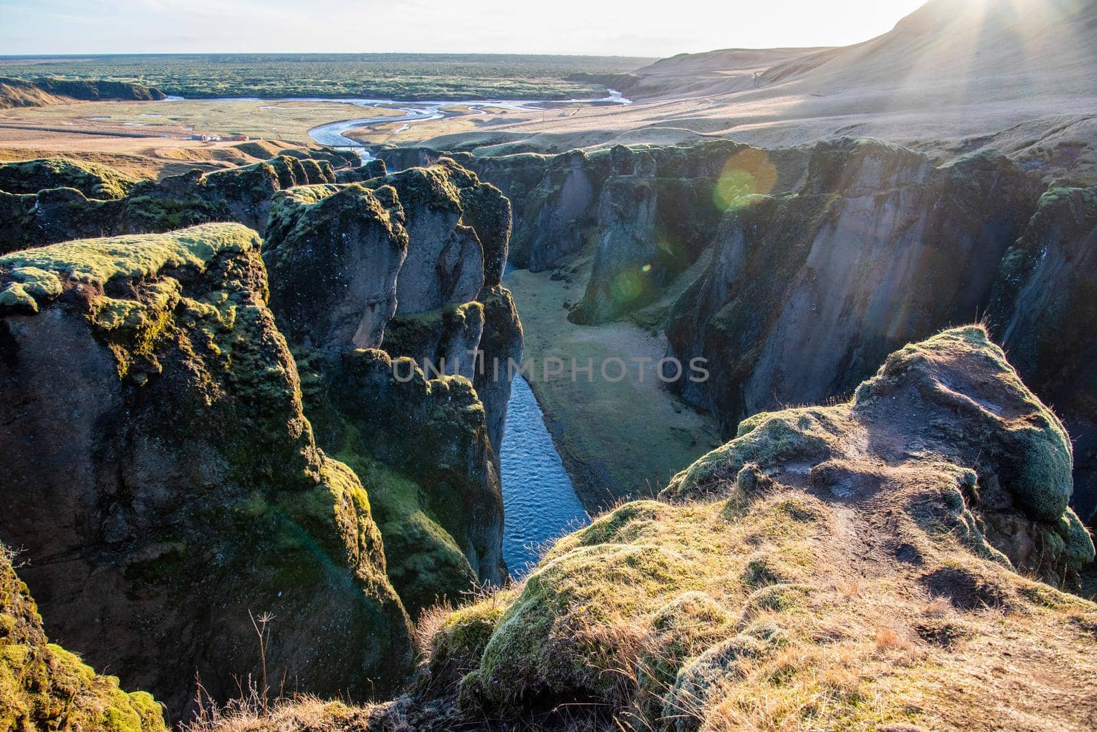 Fjaorargljufur, Iceland mossy green canyon Closeup of the river from the top. by jyurinko