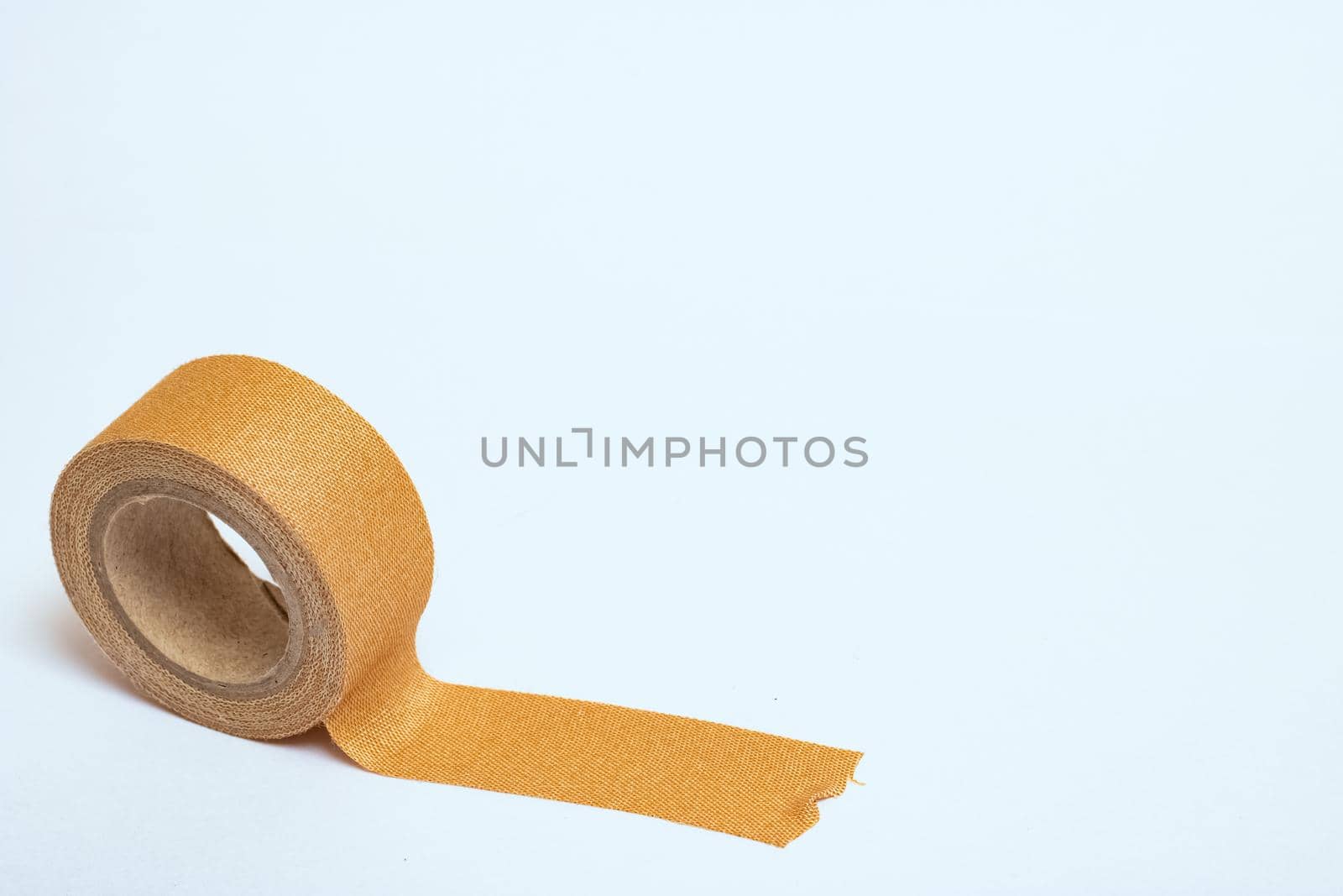 Adhesive plaster isolated on a white background close up, copy space