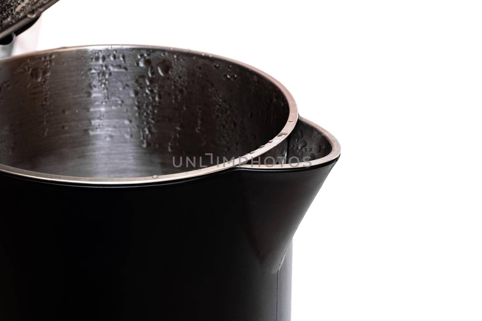 Black open electric kettle close up, isolated on white background