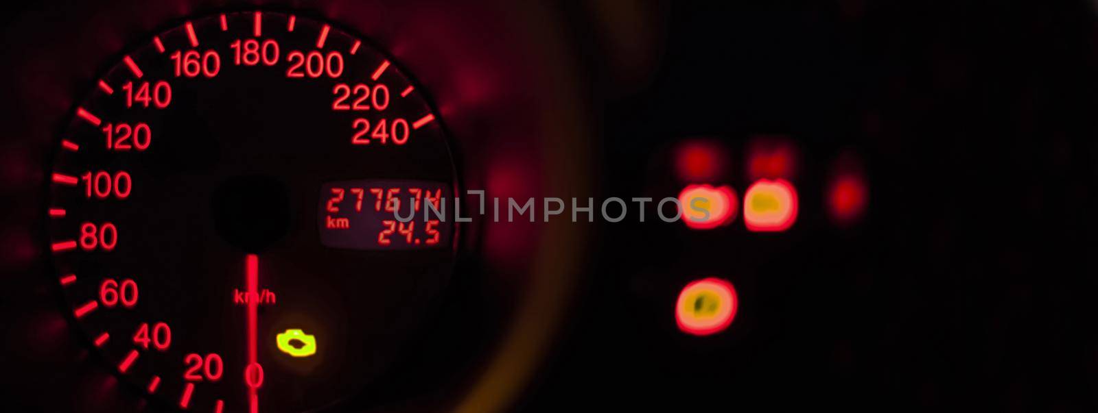 Car odometer illuminated, banner image with copy space