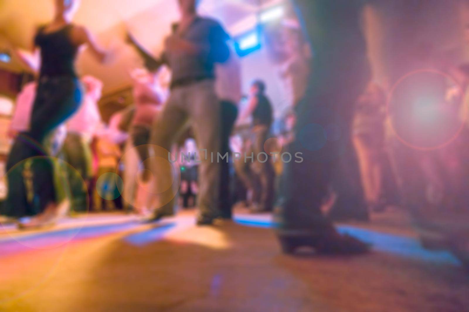 People dancing at the party abstract blur background with bokeh