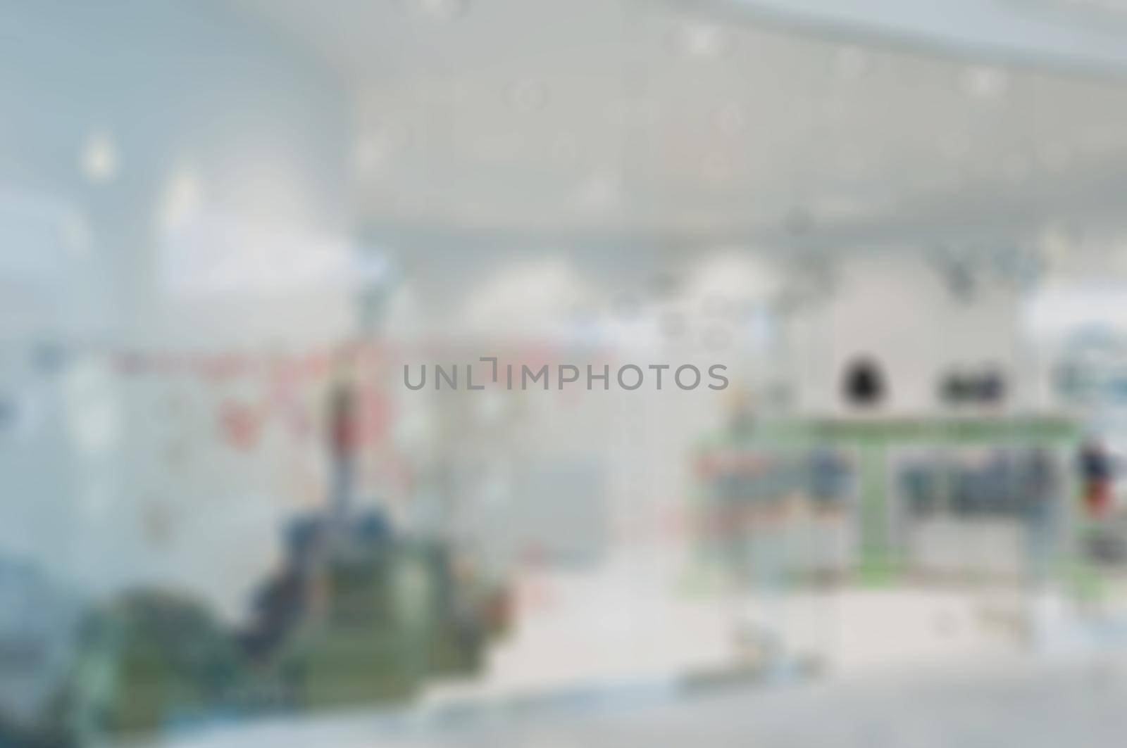 Abstract blur of clothing store by nikitabuida