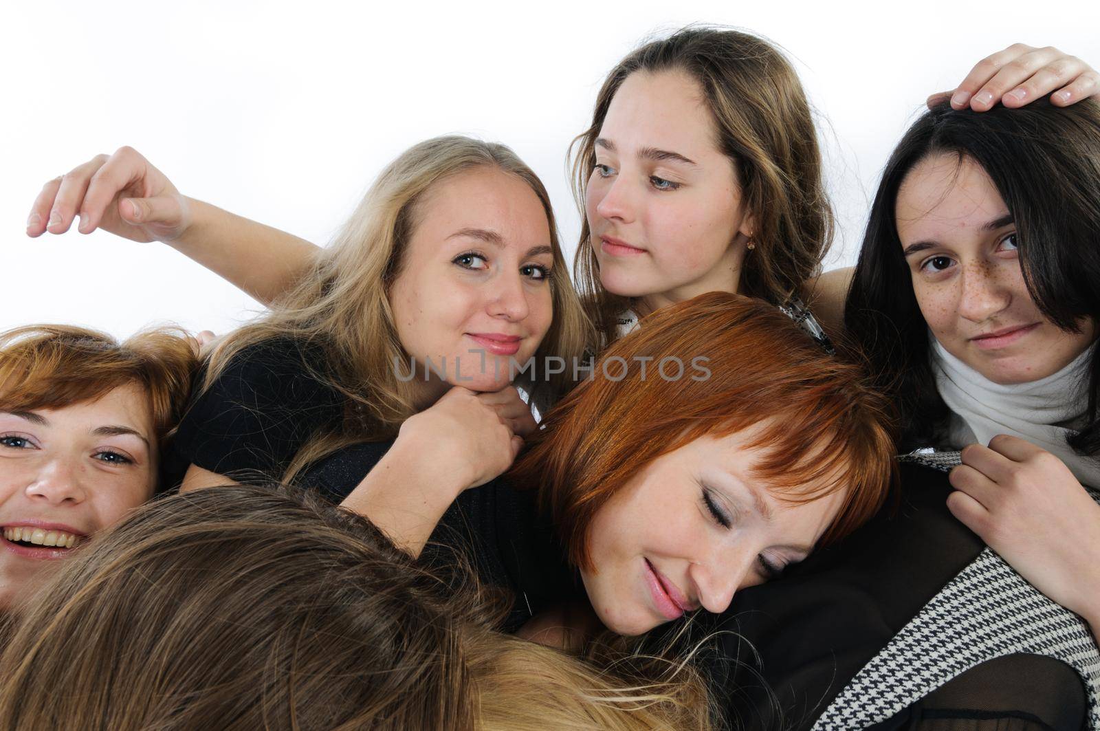 Beautiful young women friends together in studio