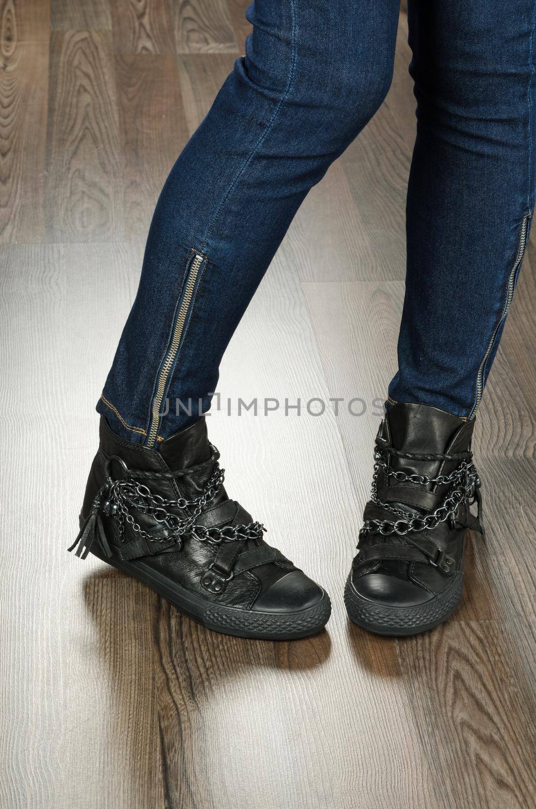 Modern fashionable women shoes shot in office - closeup on feet