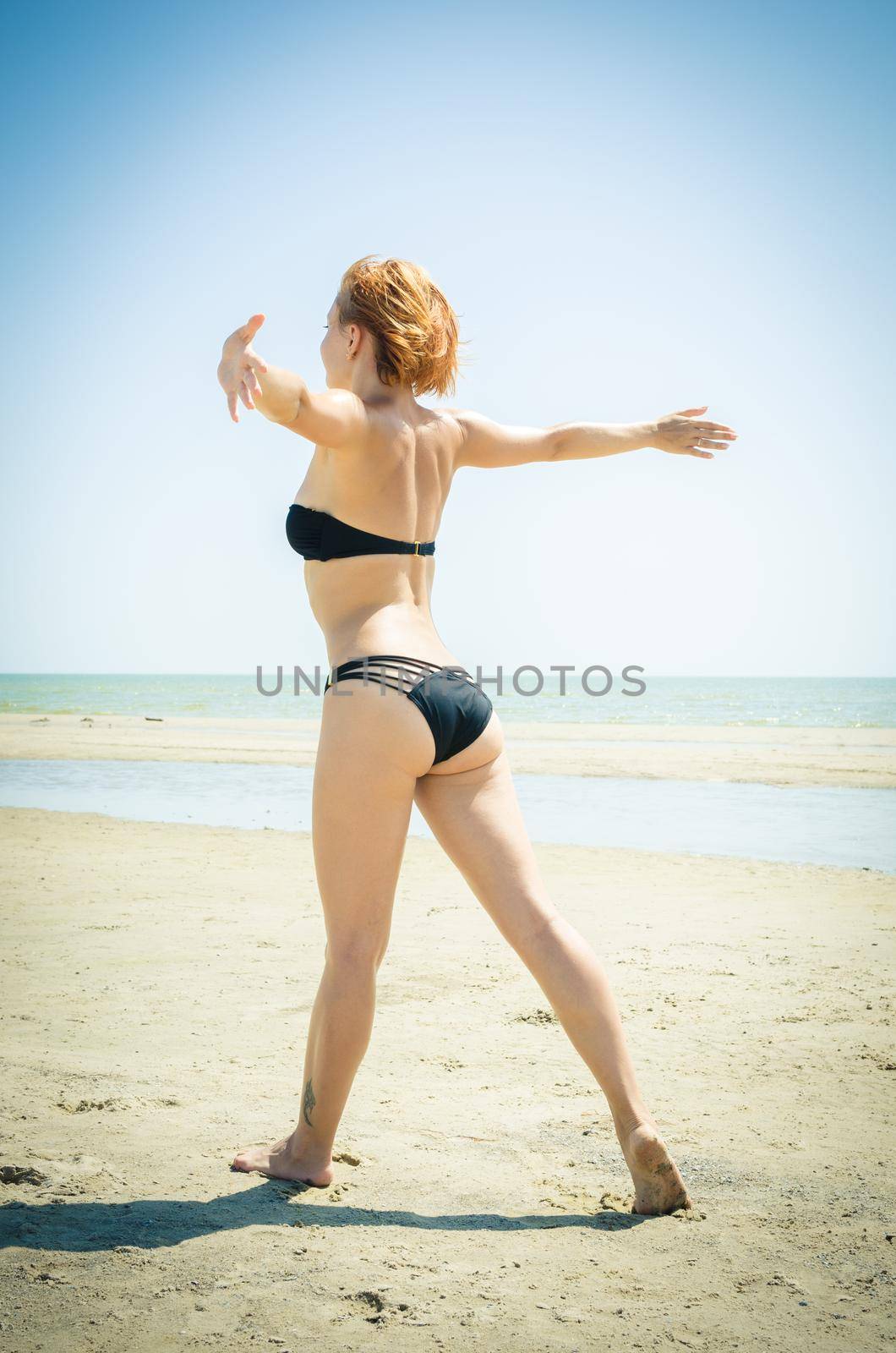 Beautiful woman on a beach by nikitabuida