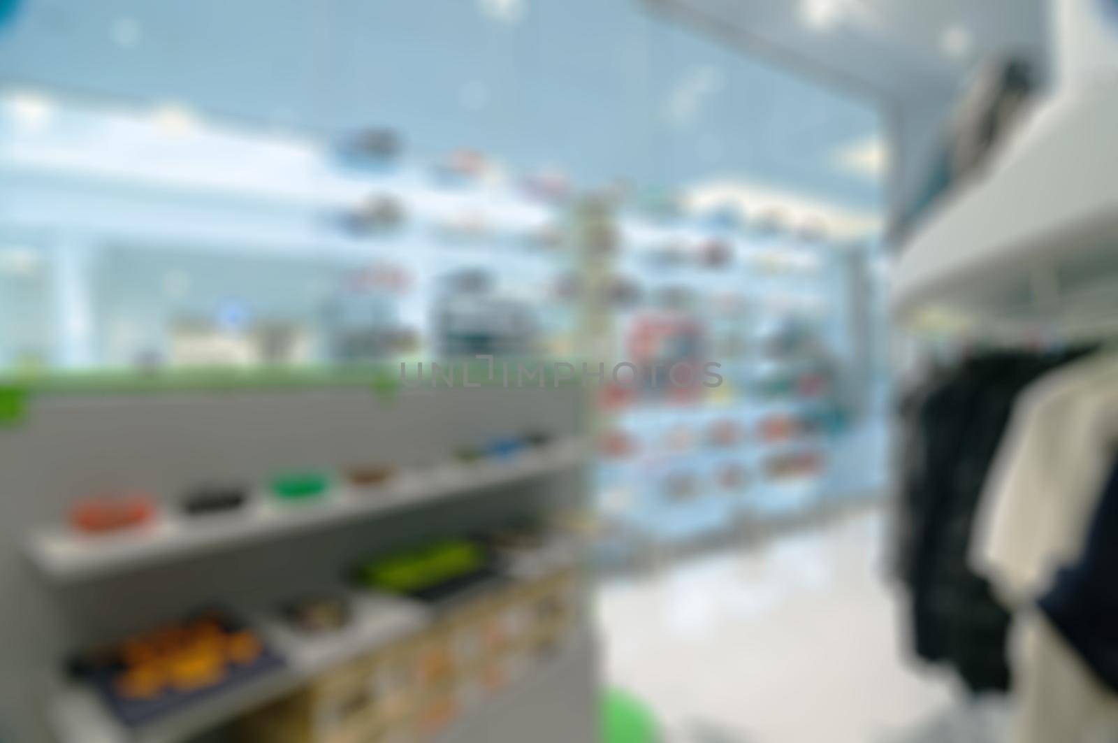 Abstract blur background. Interior of clothing store buitique in modern shopping mall
