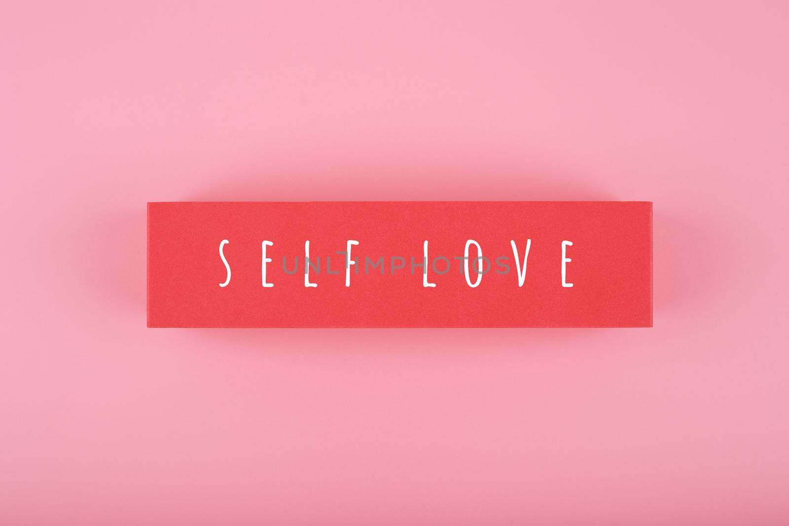 Self love minimal creative concept in pink colors against pink background with copy space by Senorina_Irina