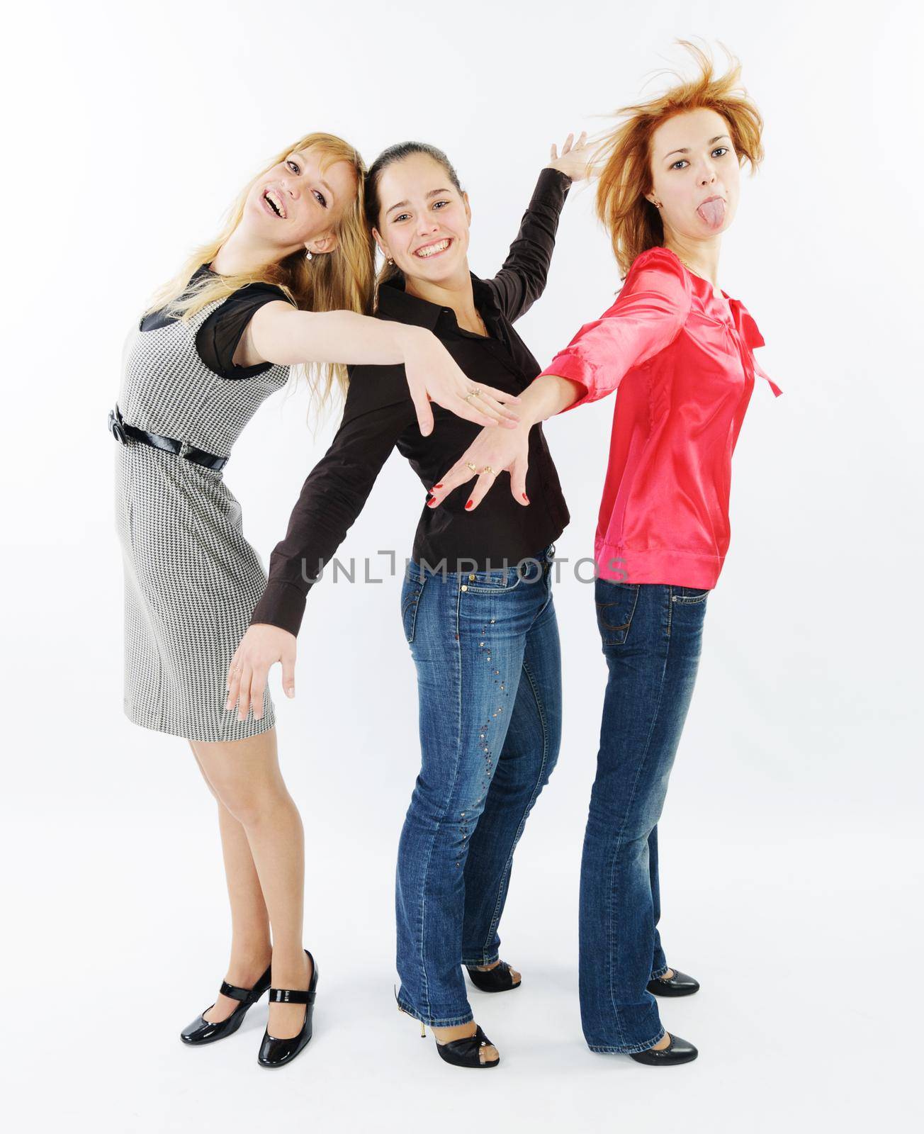 Beautiful young women friends together in studio