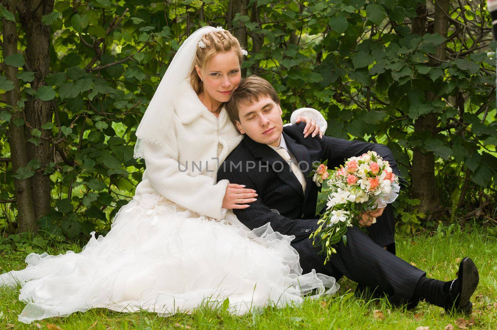 Young wedding couple together after the ceremony