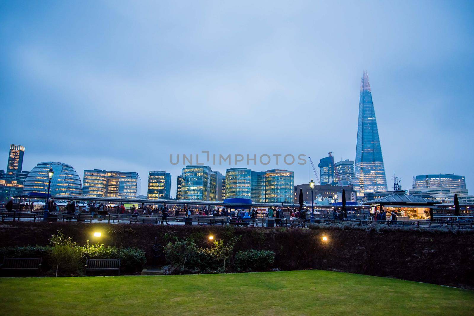 London, UK - January 26, 2017: London UK skyline from the Tower of London castle view of the Shard with golden windows of buildings at blue hour