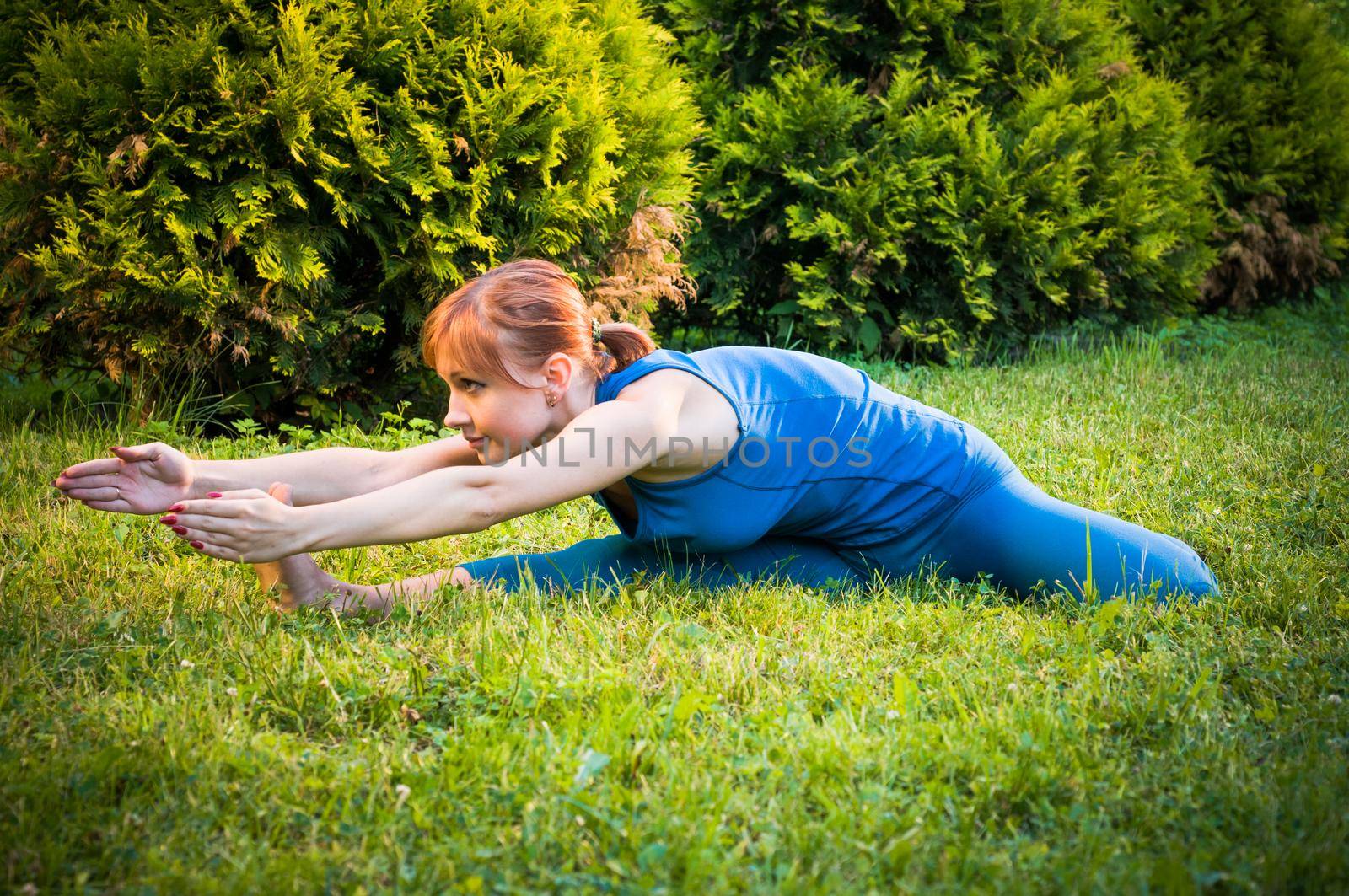 Beautiful woman practicing fitness or yoga by nikitabuida