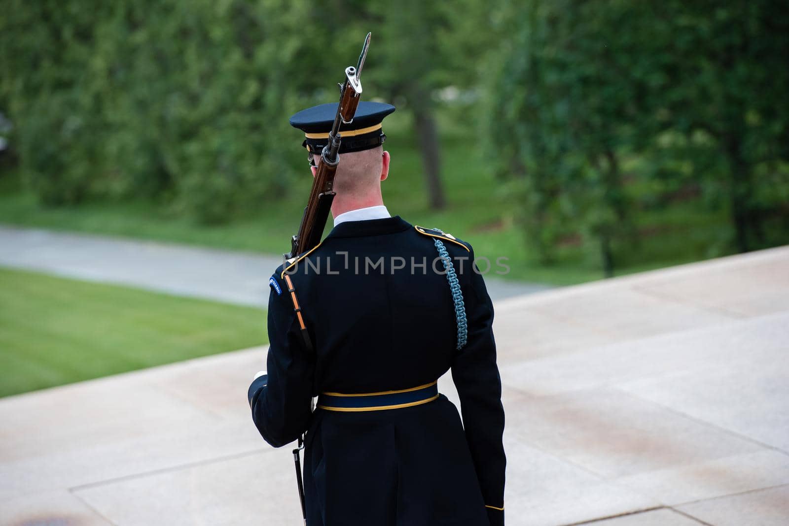 Ceremony at the Tomb of the Unknown soldier in Arlington, VA cadet from the back