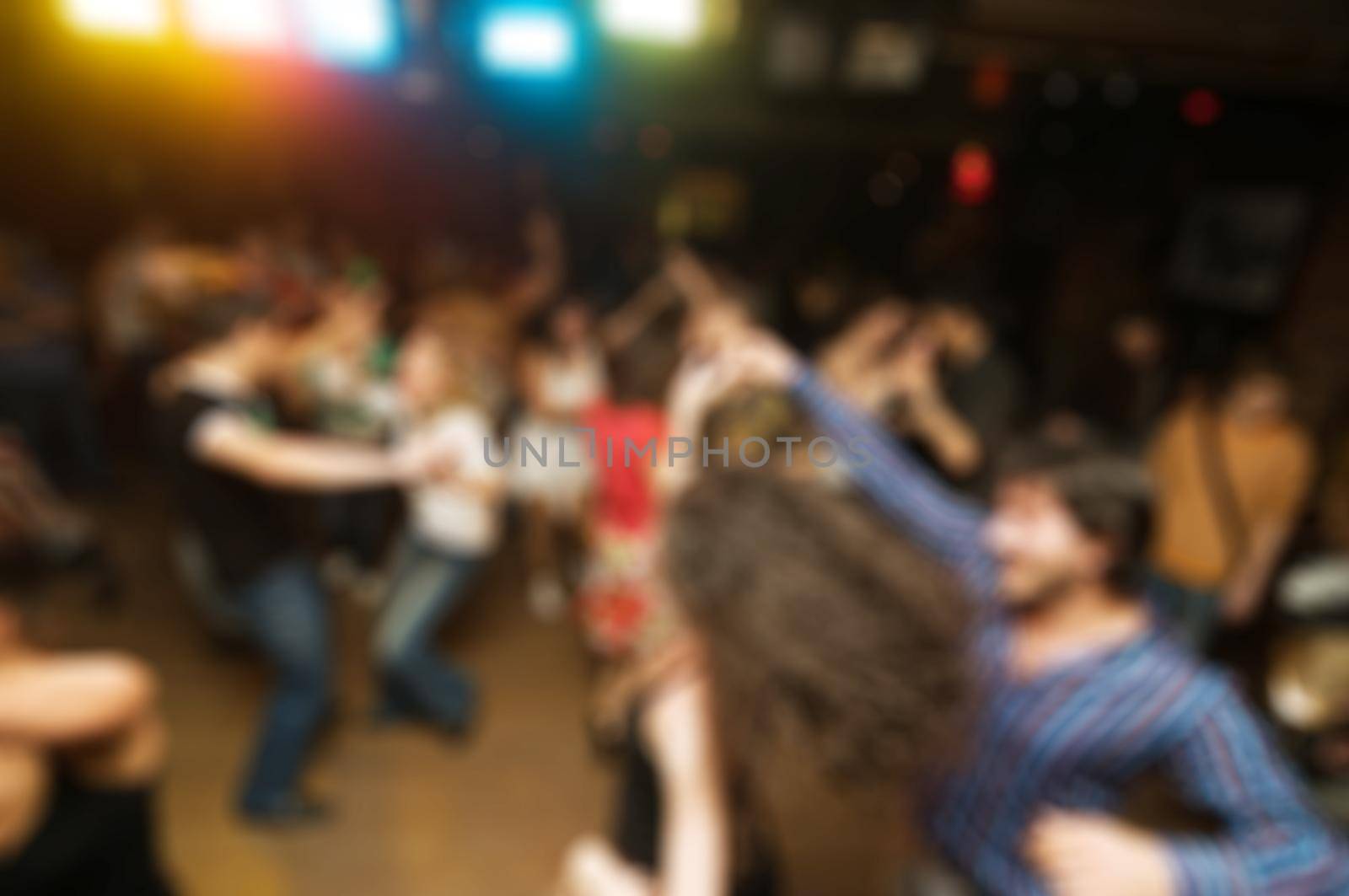 People dancing at the party abstract blur background with bokeh