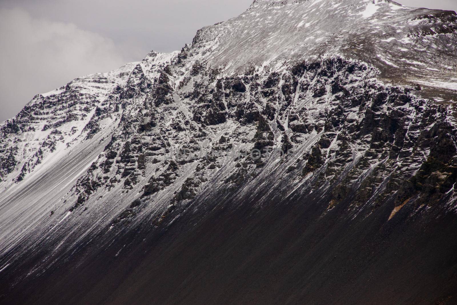 Snow capped mountain ridge black and white Icelandic texture heavenly awe inspiring wow breathtaking by jyurinko