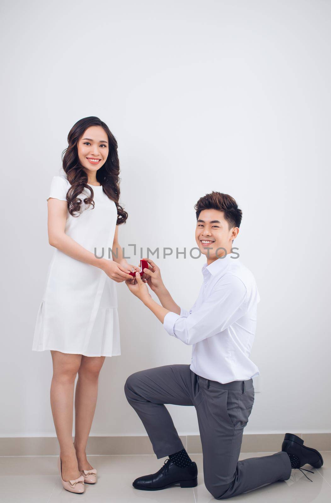 Proposal. Handsome man showing engagement diamond ring to his girlfriend. Proposed wedding. by makidotvn