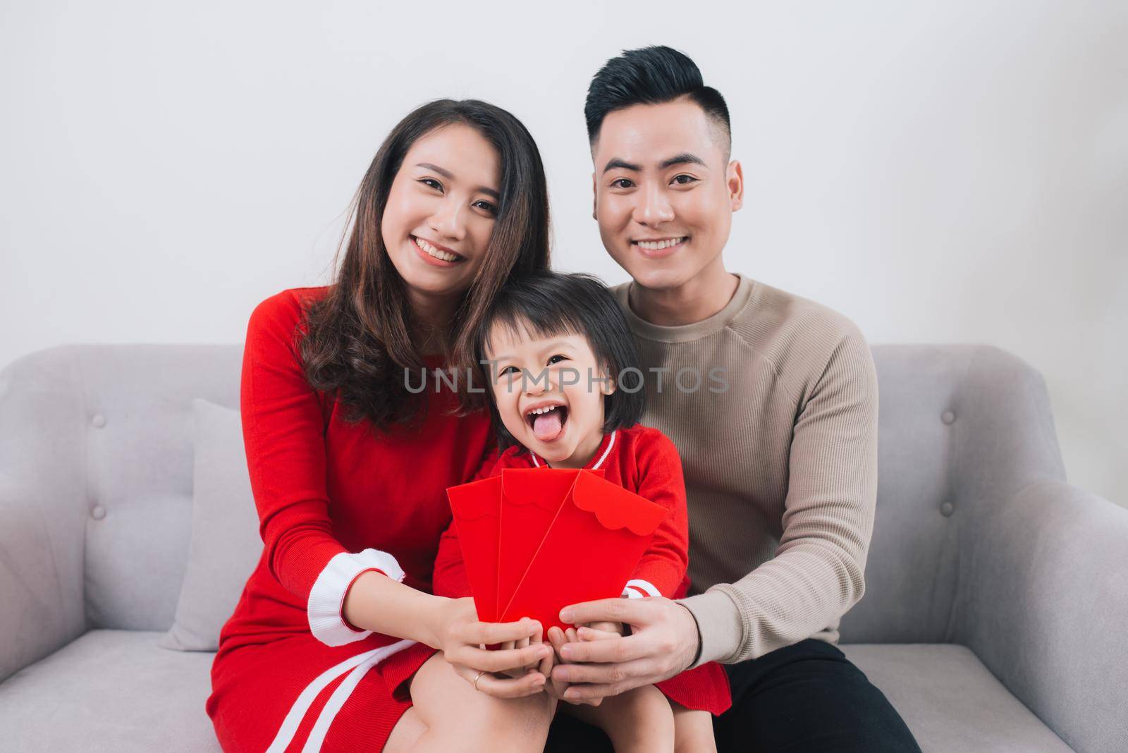Happy Vietnamese family celebrate Lunar new year at home.