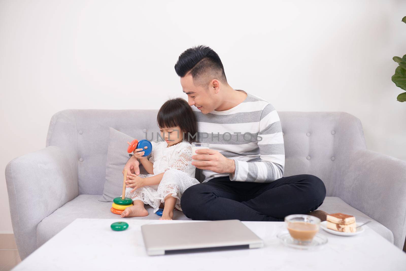 Father and daughter playing with bricks by makidotvn