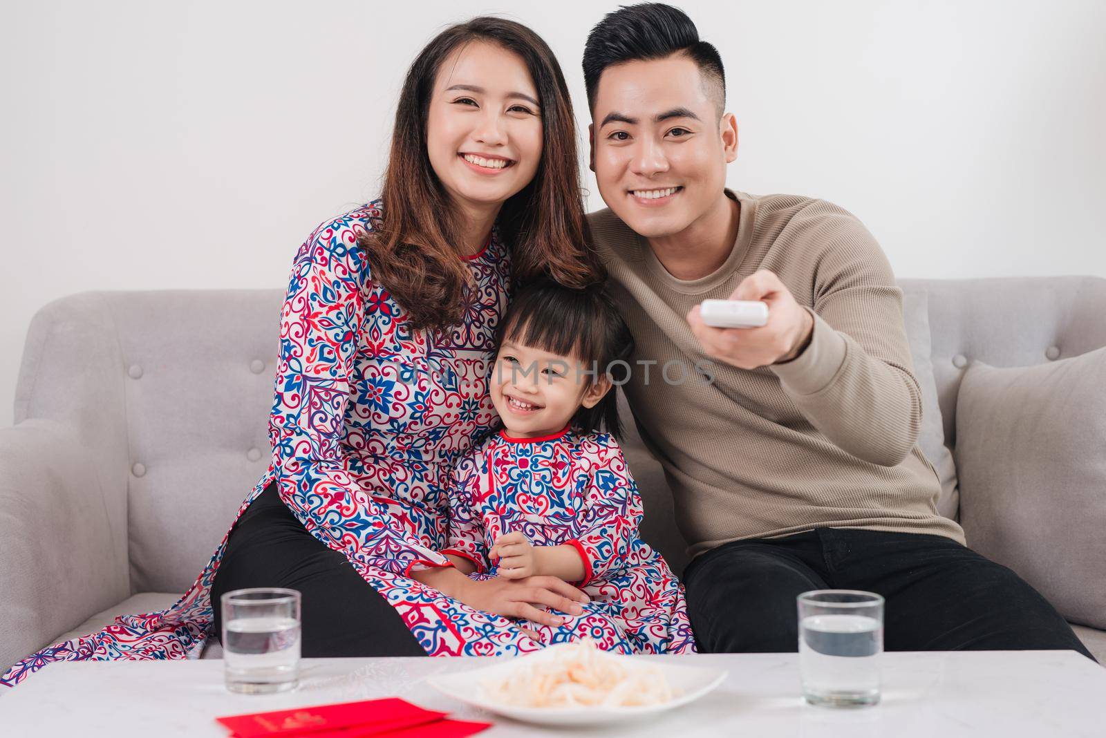 Happy Vietnamese family celebrate Lunar new year at home.