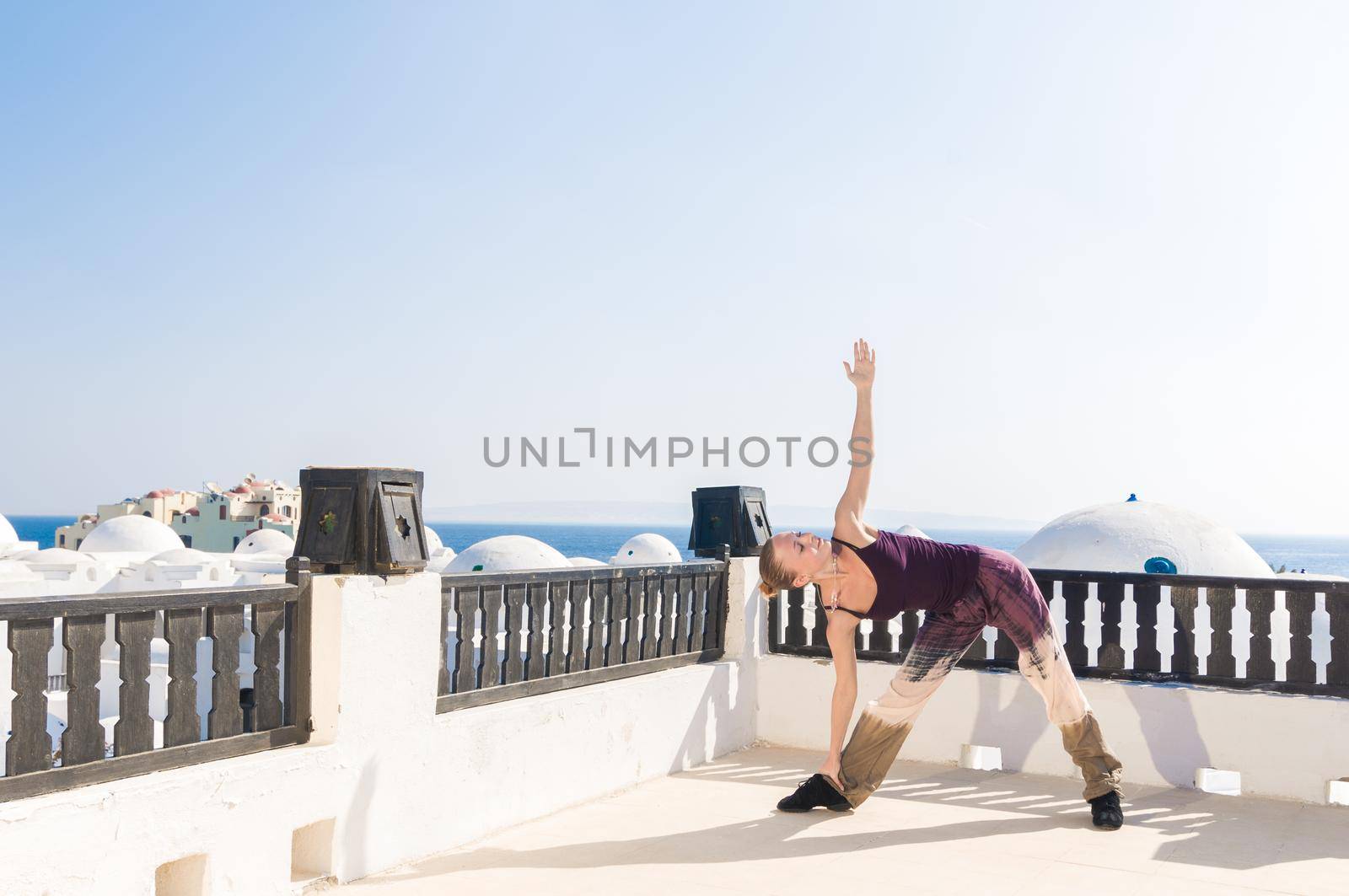 Woman practicing padmasana by nikitabuida