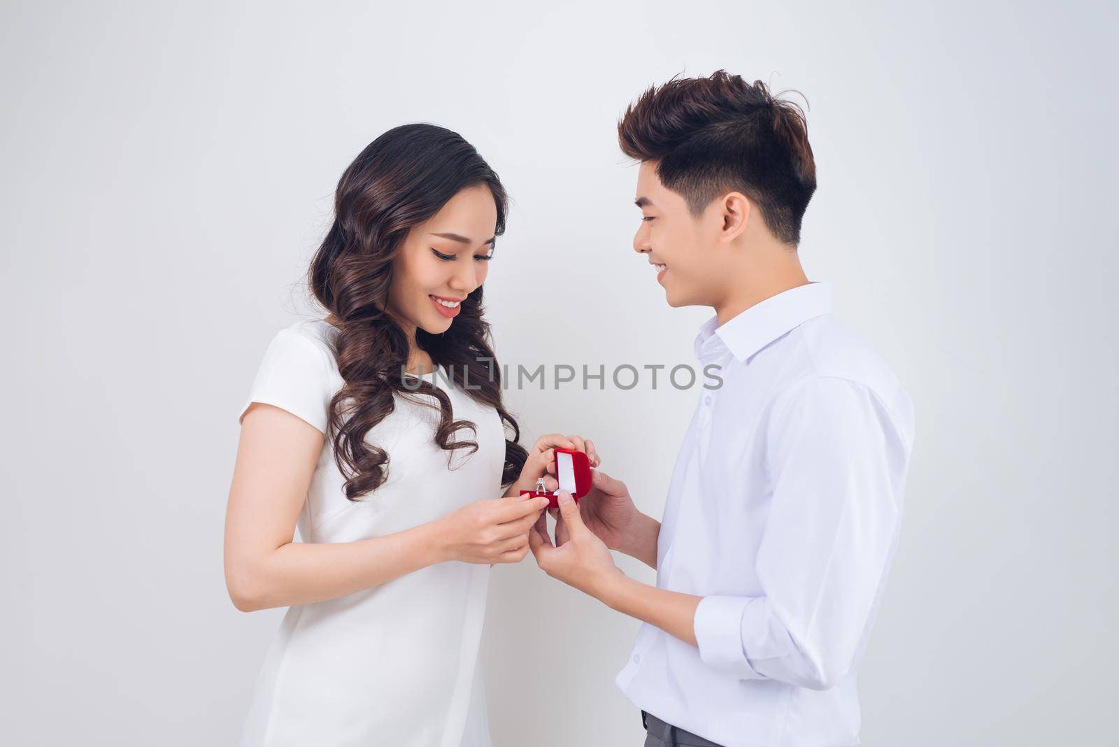 Proposal. Handsome man showing engagement diamond ring to his girlfriend. Proposed wedding.