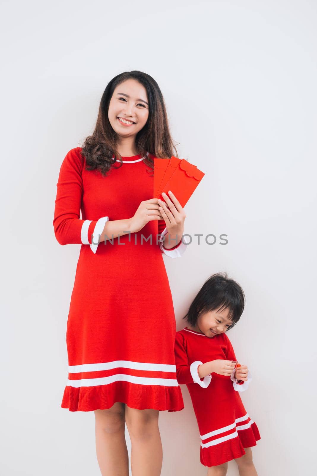 Vietnamese mother and daughter celebrate new year at home. Tet Holiday. by makidotvn