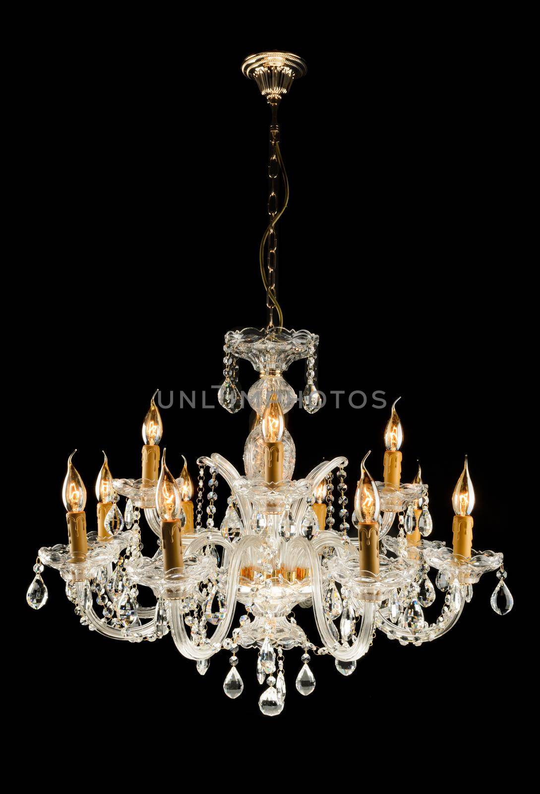 Contemporary glass chandelier isolated over black background
