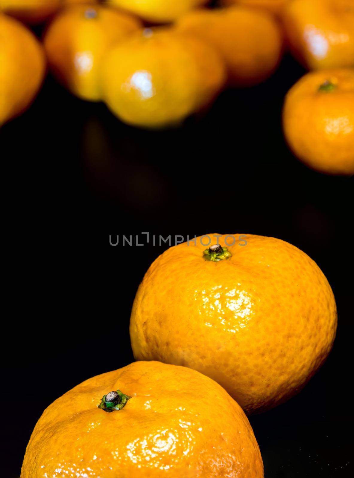 Close-up of Water droplet on glossy surface of freshness red apple on black background