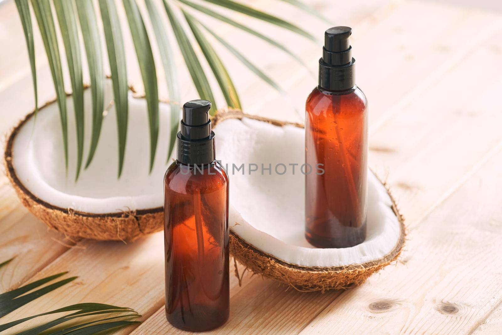 Coconut oil with fresh coconut for alternative therapy on wooden background by makidotvn